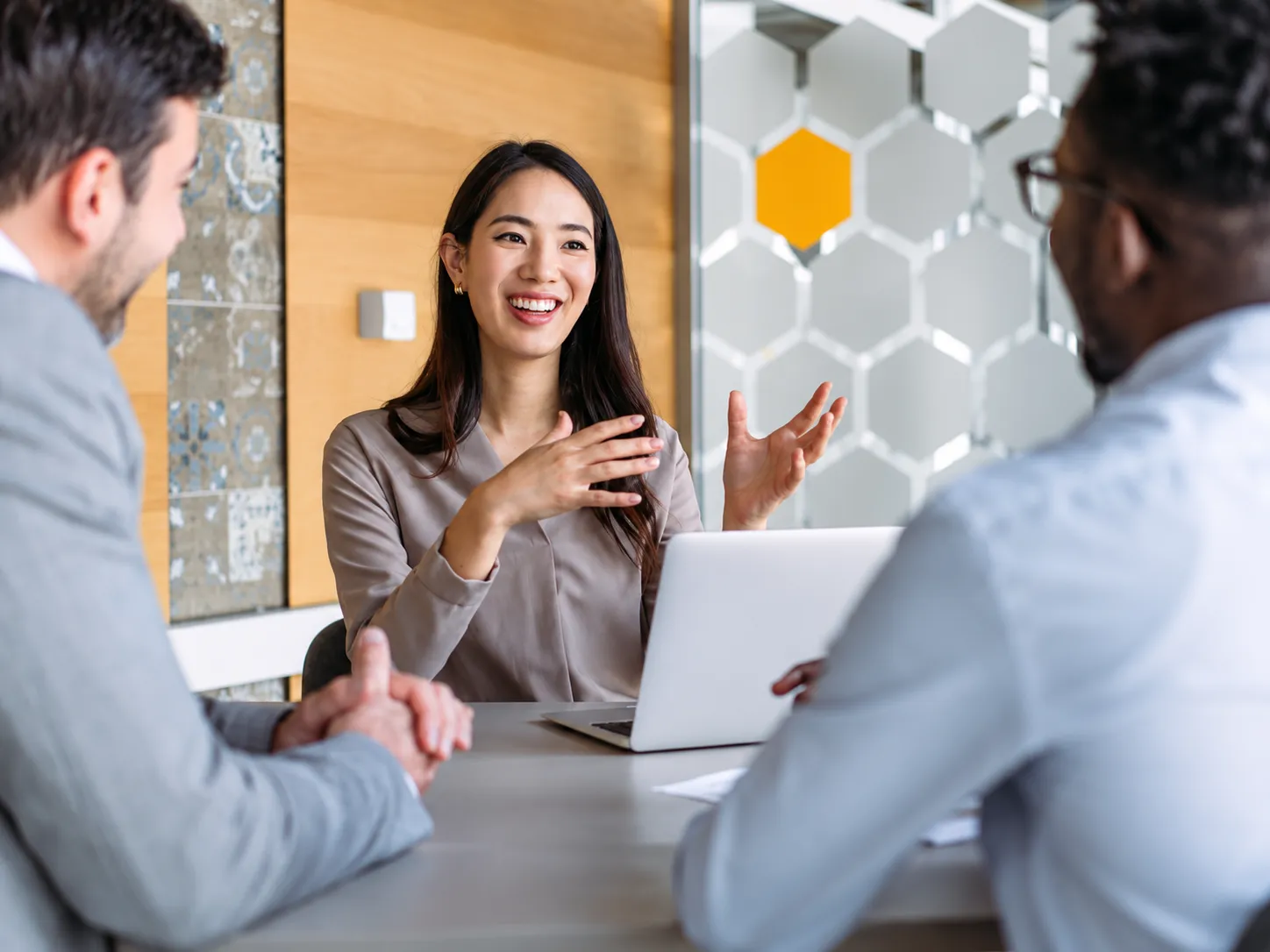 Colleagues reviewing documents during an office meeting