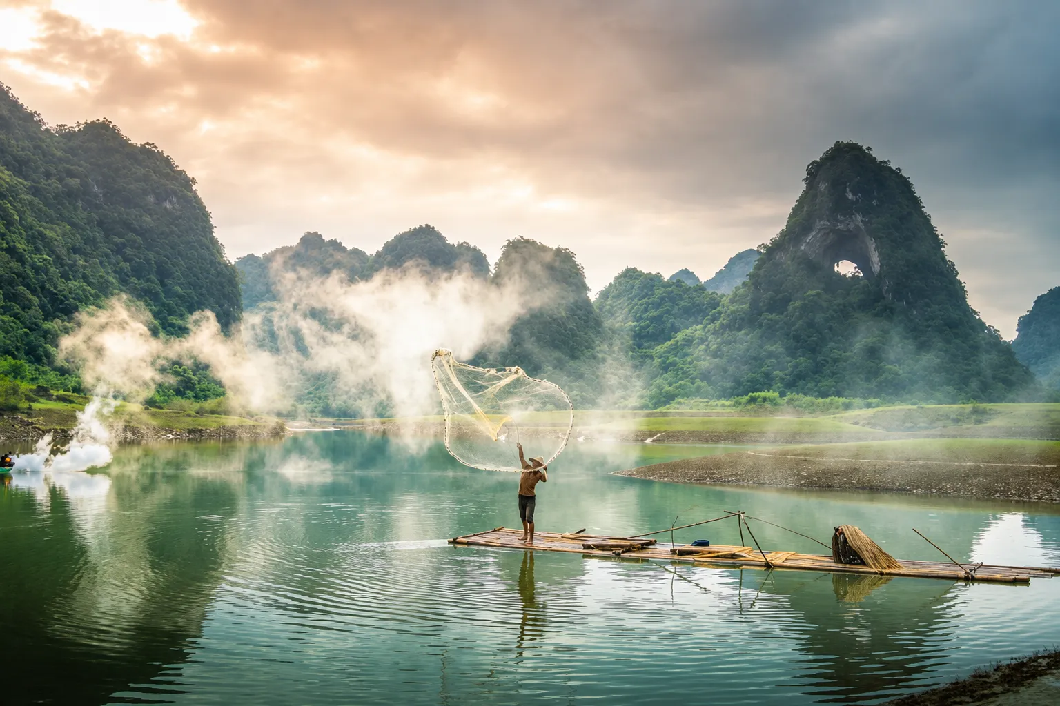 A fisherman casting a net from a bamboo raft among limestone hills in northern Vietnam