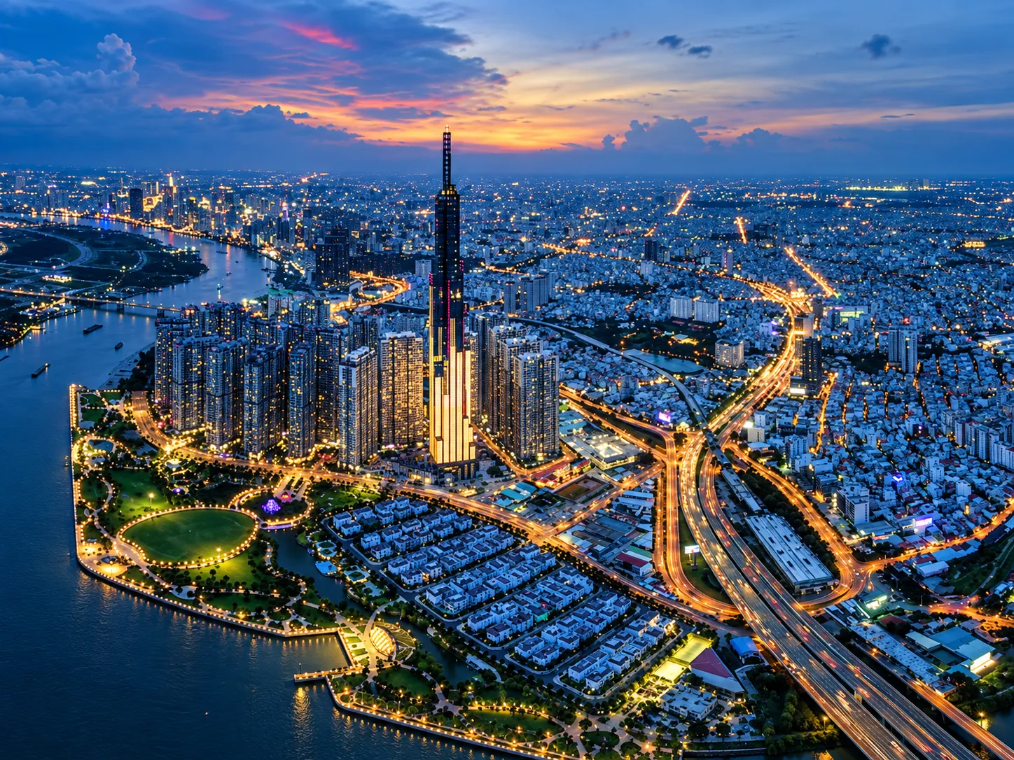 Vietnam city and river illuminated at dusk